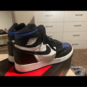 Nike Air Jordan High Tops in Black, White, and Blue